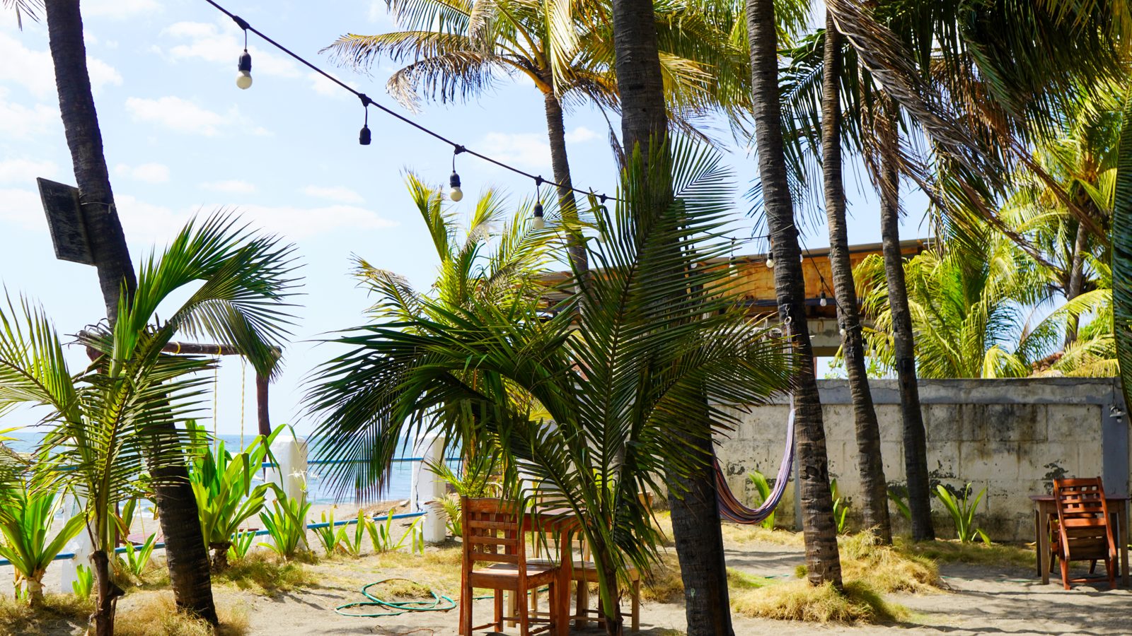 Nambí Lodge terrace with hammocks and garden view